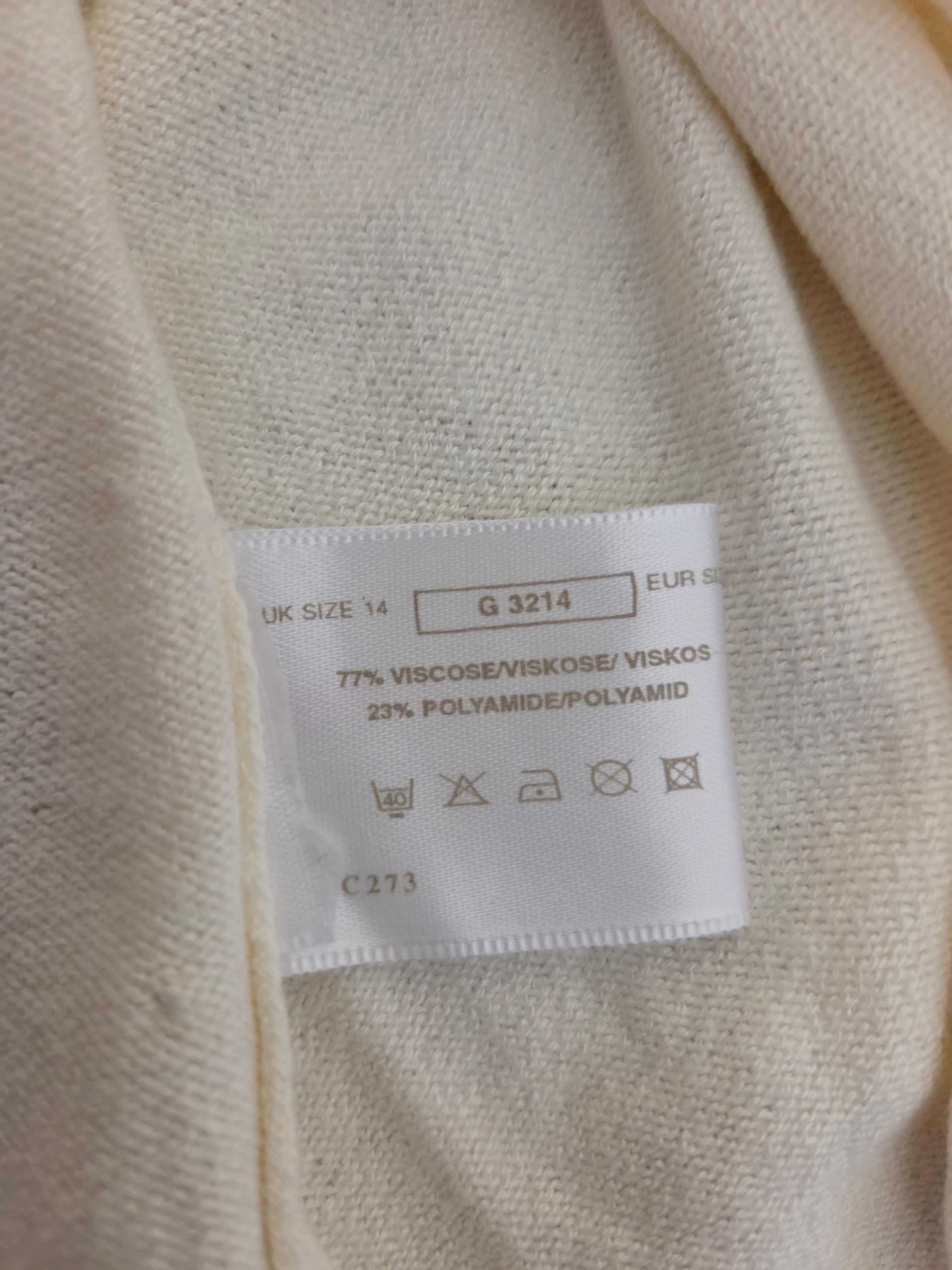 Fabric label on a beige fabric background