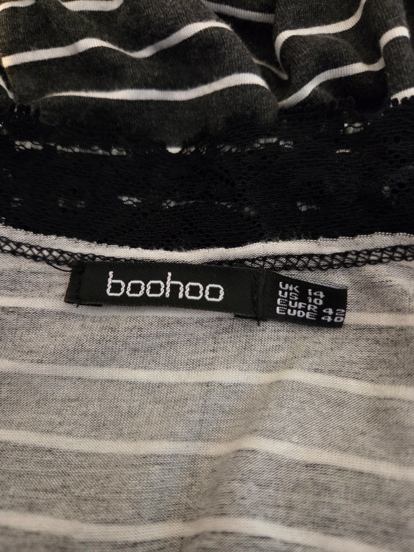 Boohoo label on a black and gray striped garment
