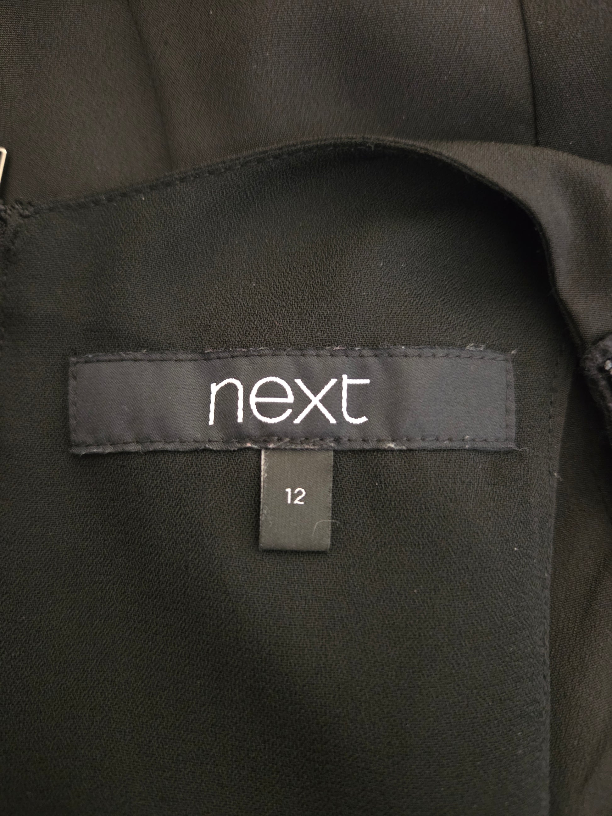 Close-up of Next size label