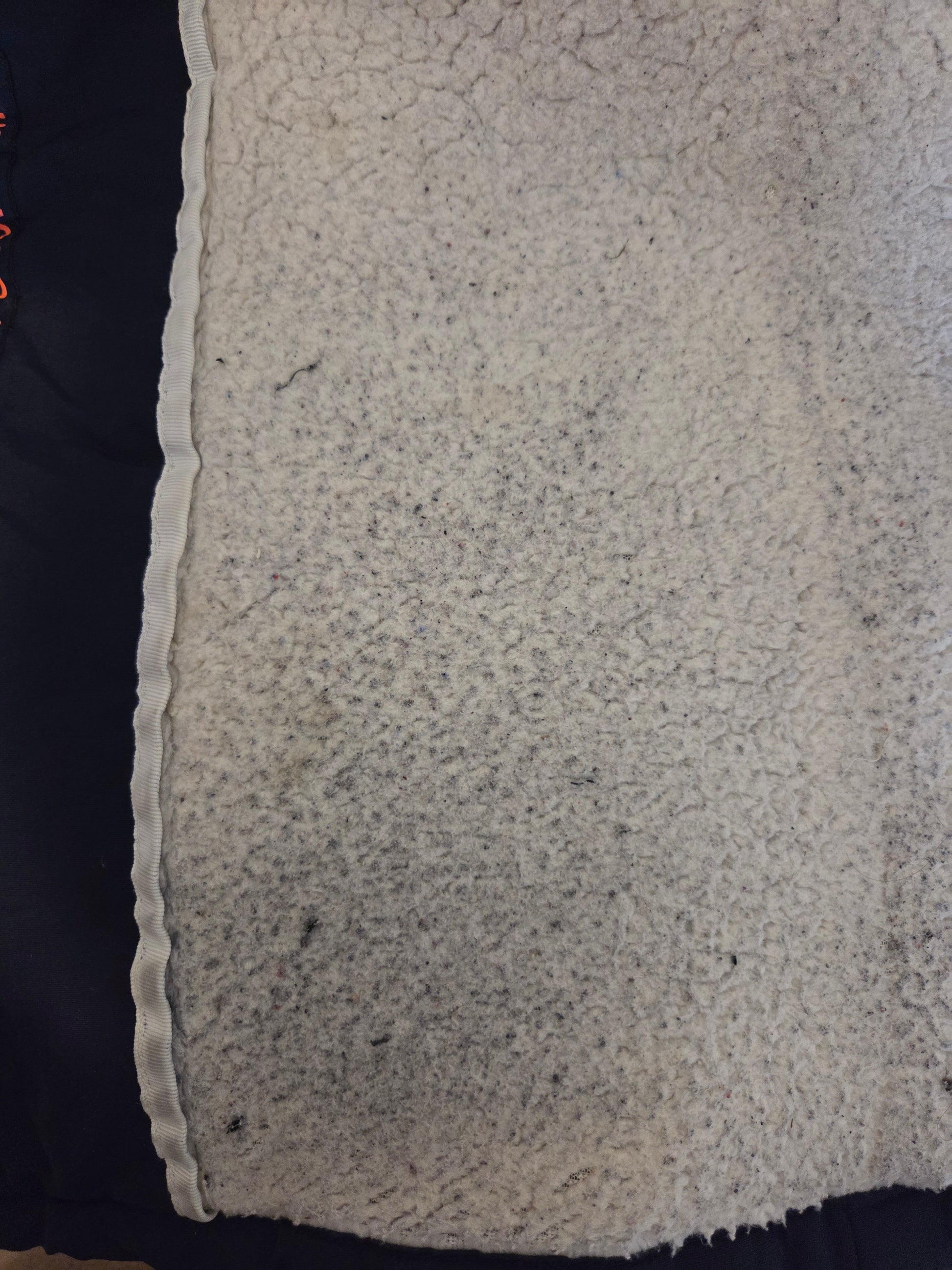 Close-up of a white fabric with some staining