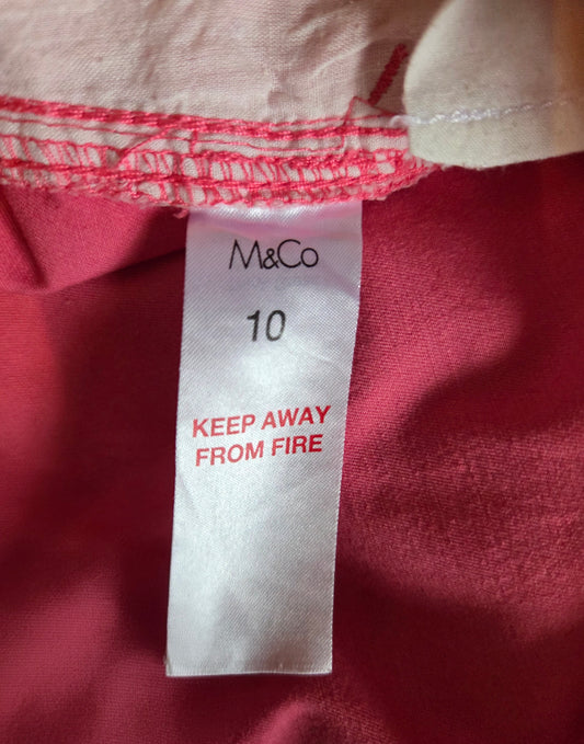 Close-up of a size label with 'M&Co' branding.