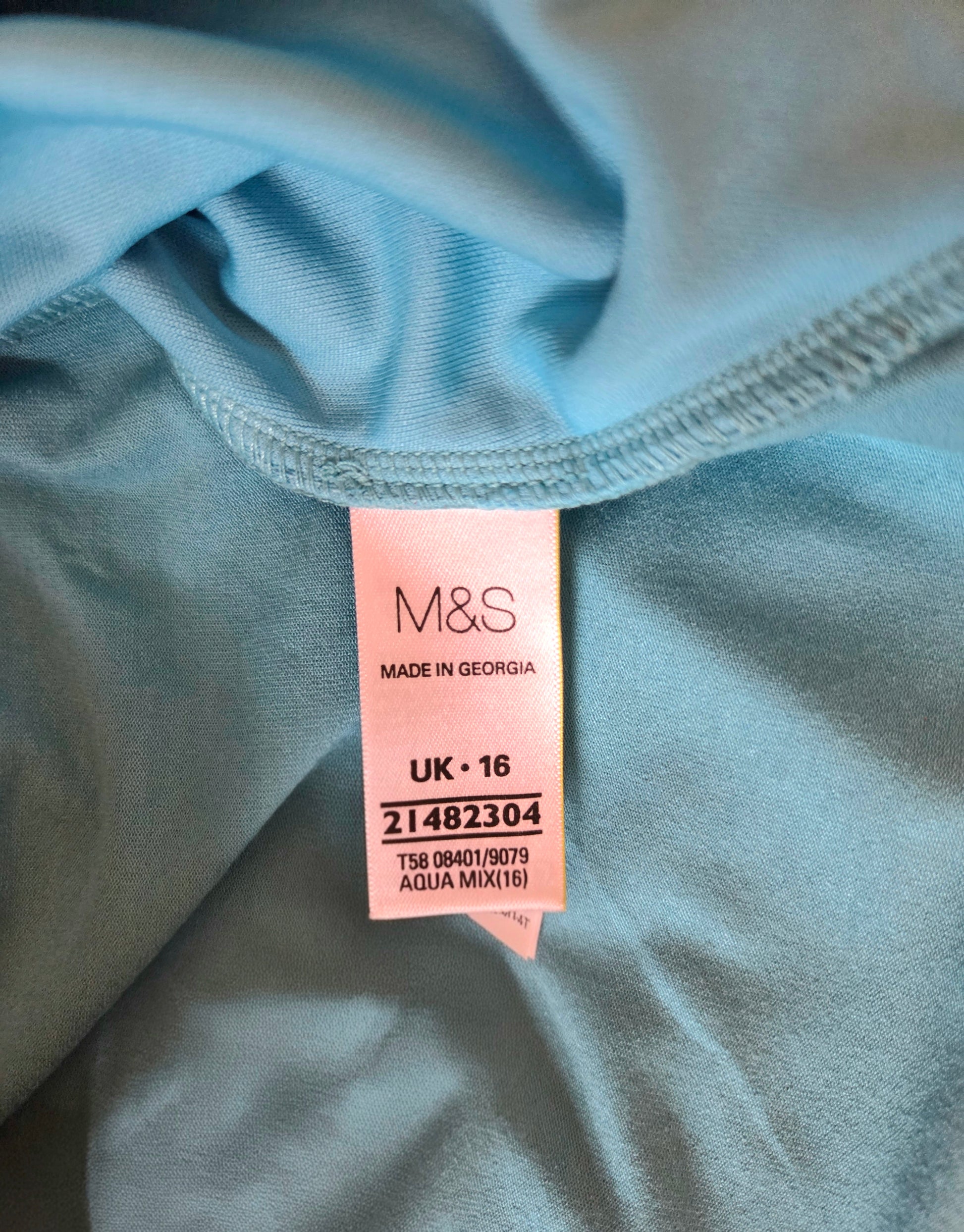 M&S size label on a light blue fabric