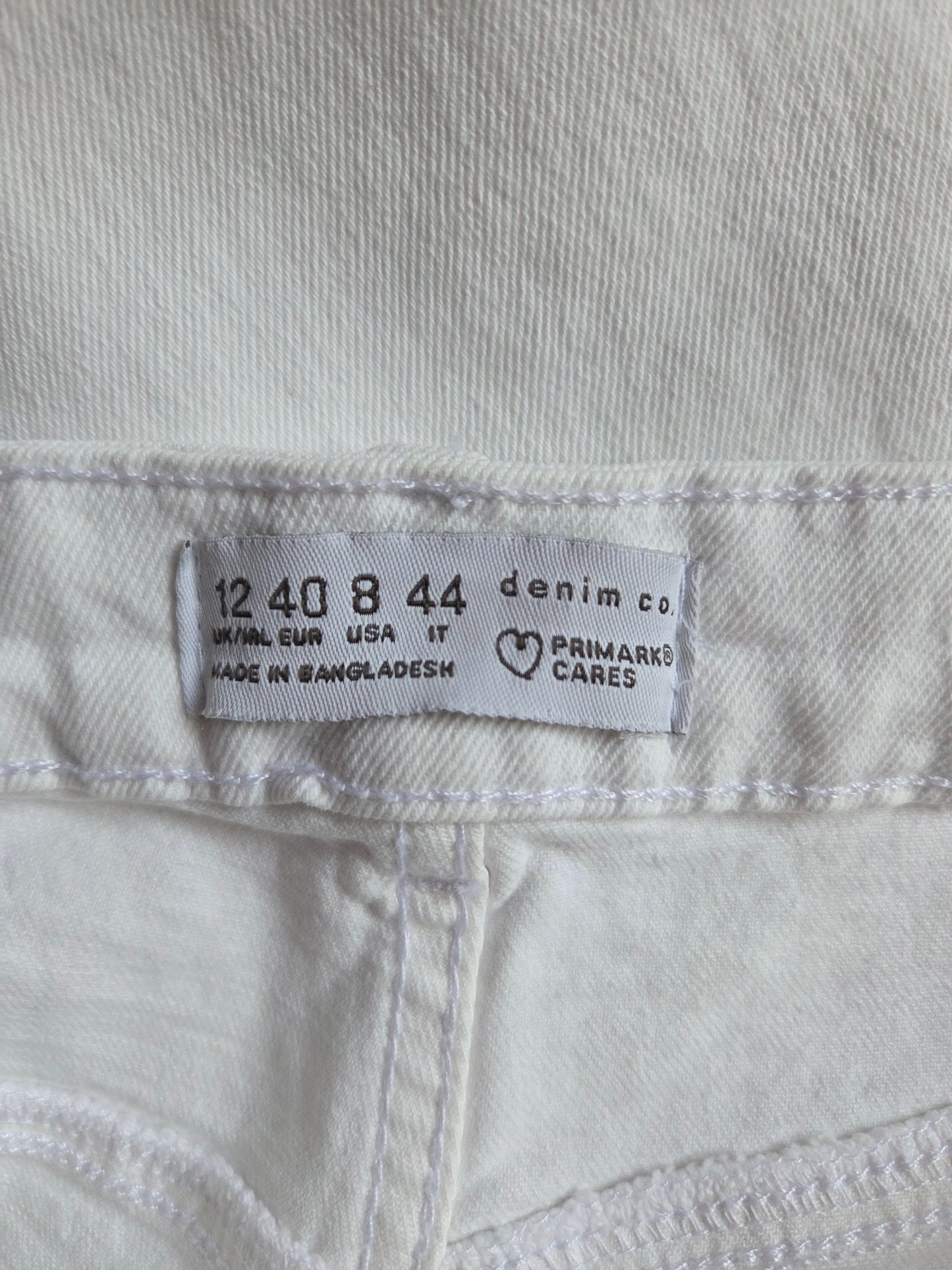  size label on a white denim fabric