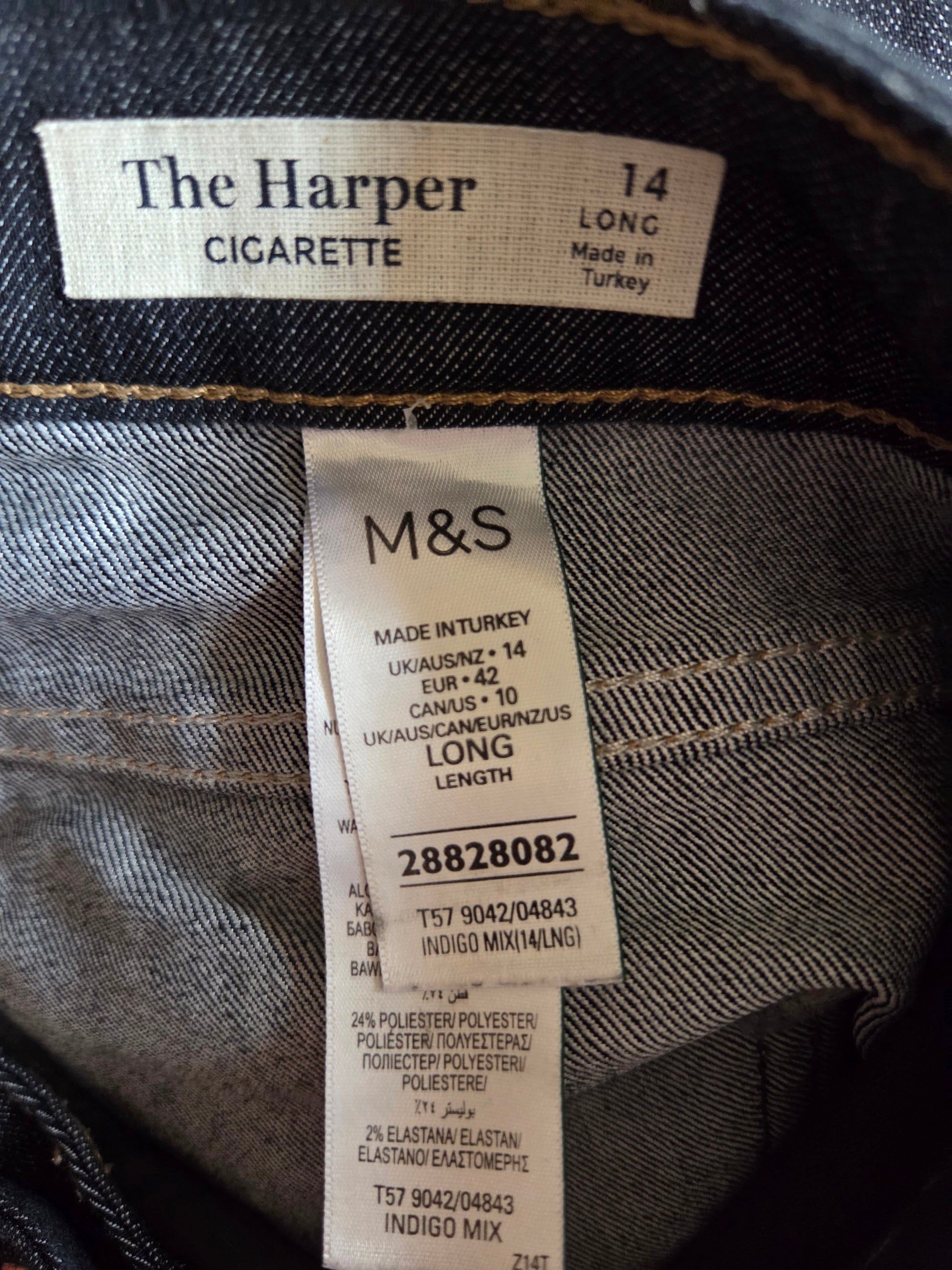 Close-up of M&S label on denim fabric with 'The Harper' cigarette label.