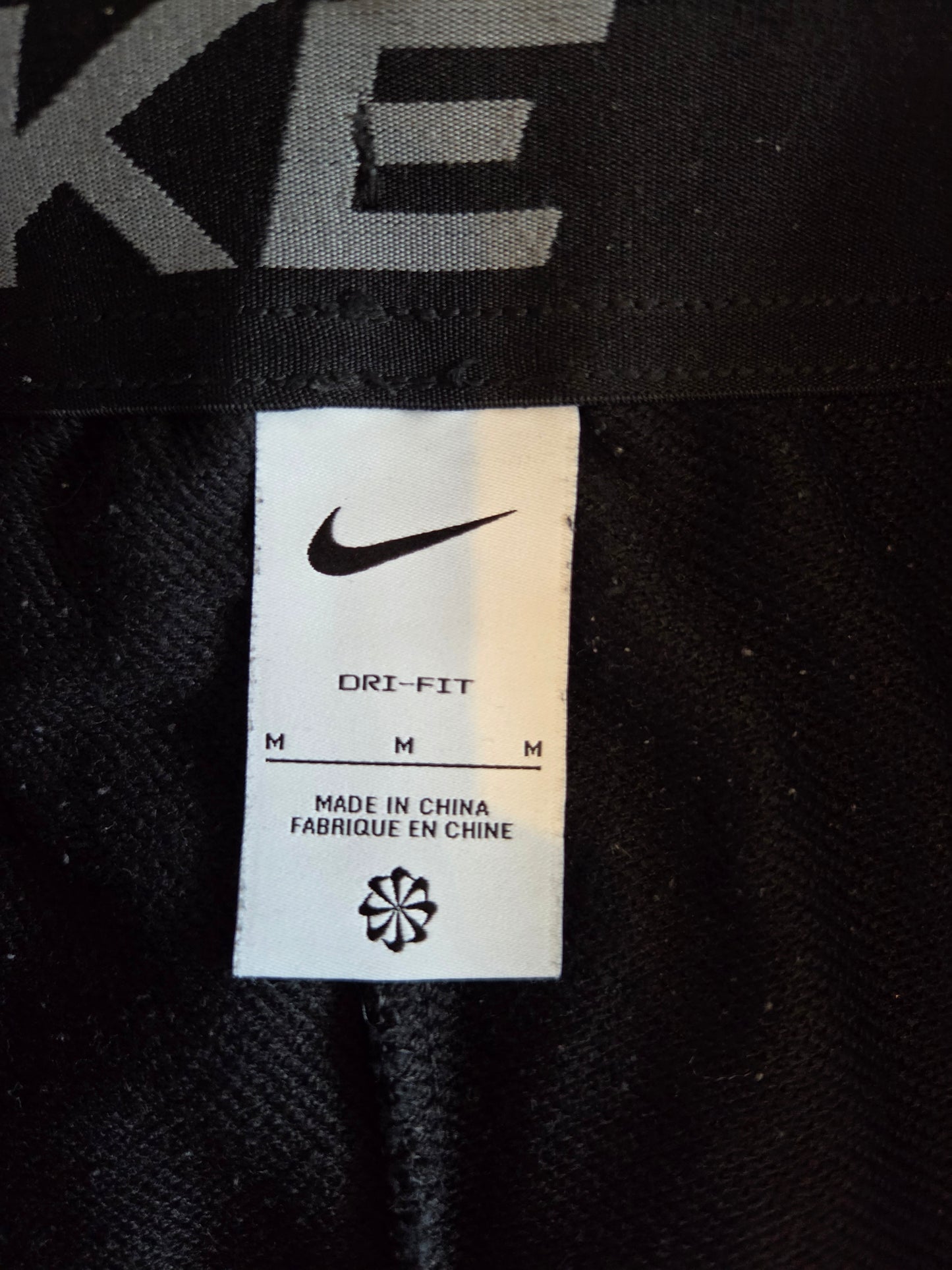 Nike swoosh Dri-Fit size tag