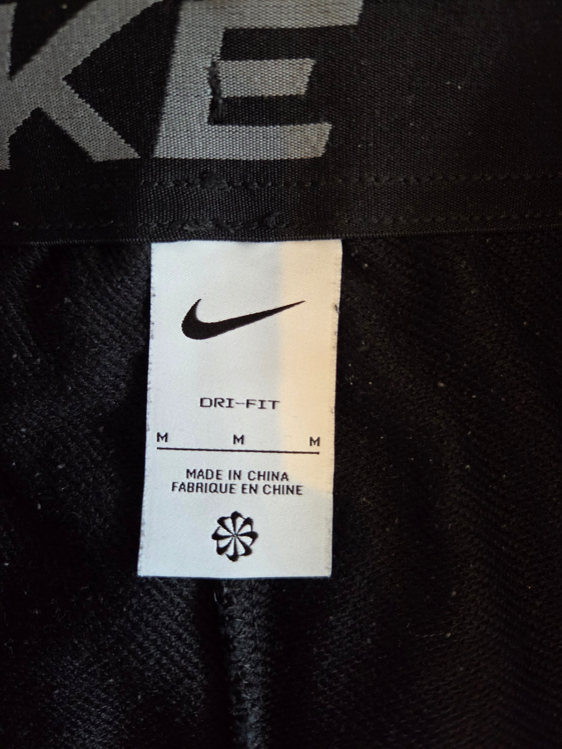 Nike swoosh Dri-Fit size tag