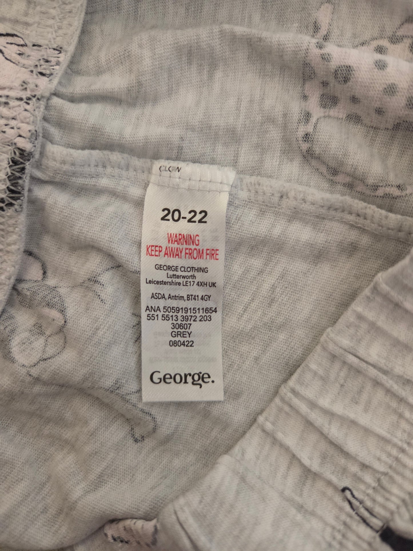 Clothing tag on a piece of fabric with 'George' branding