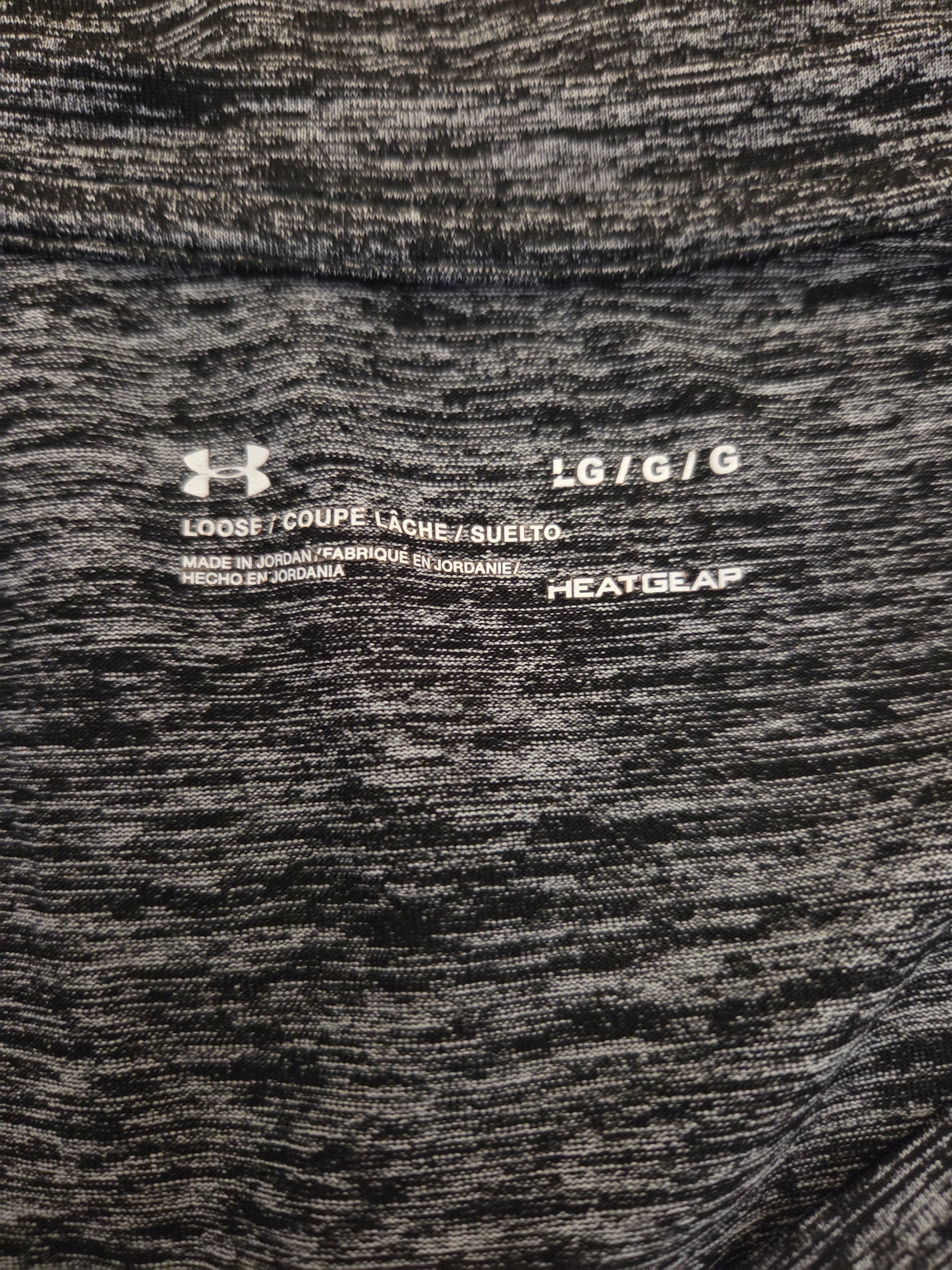 Under Armour size label on a grey marl t shirt