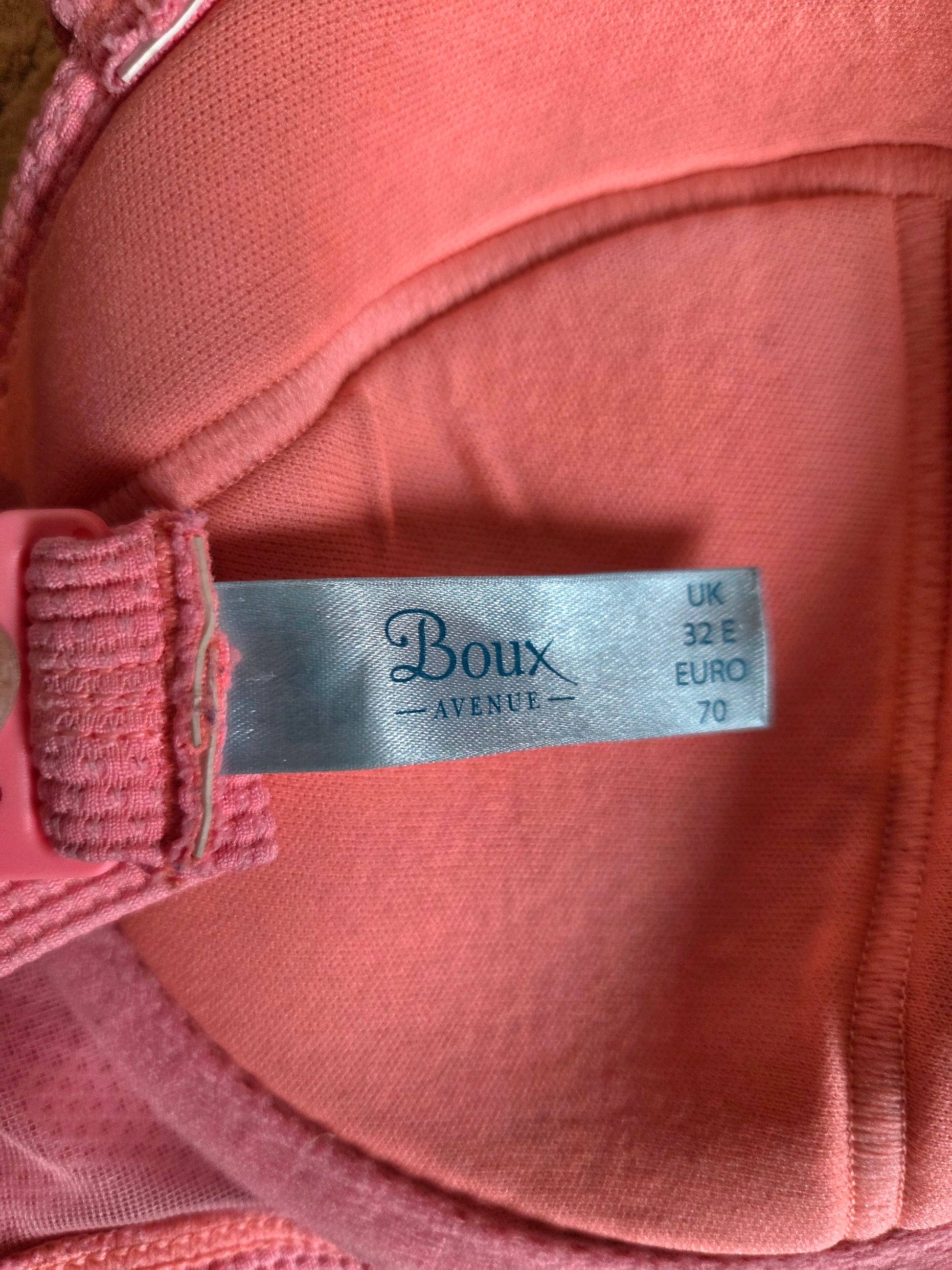 Close-up of a pink garment with a 'Boux Avenue' label.