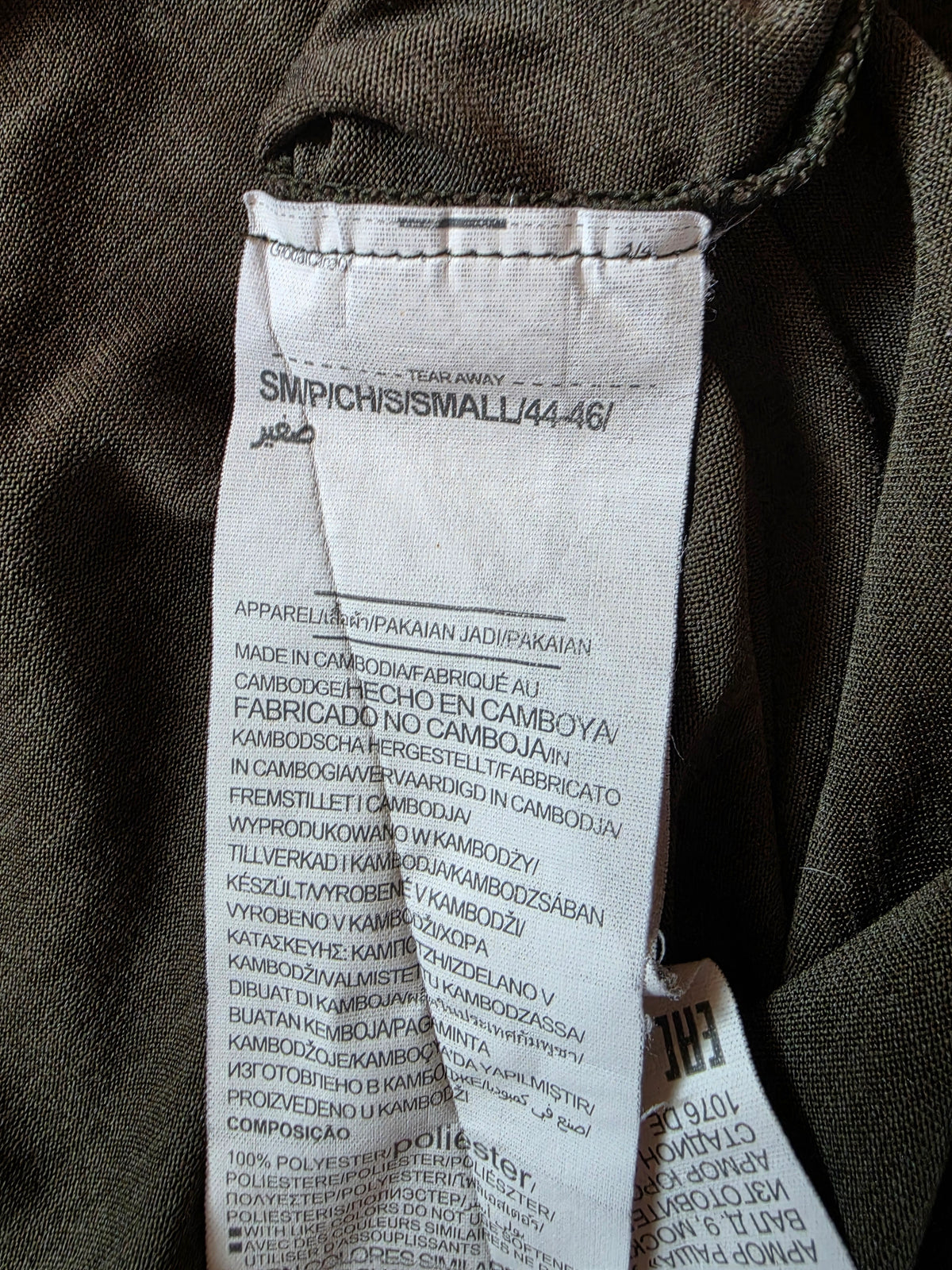 size label on a green khaki t shirt