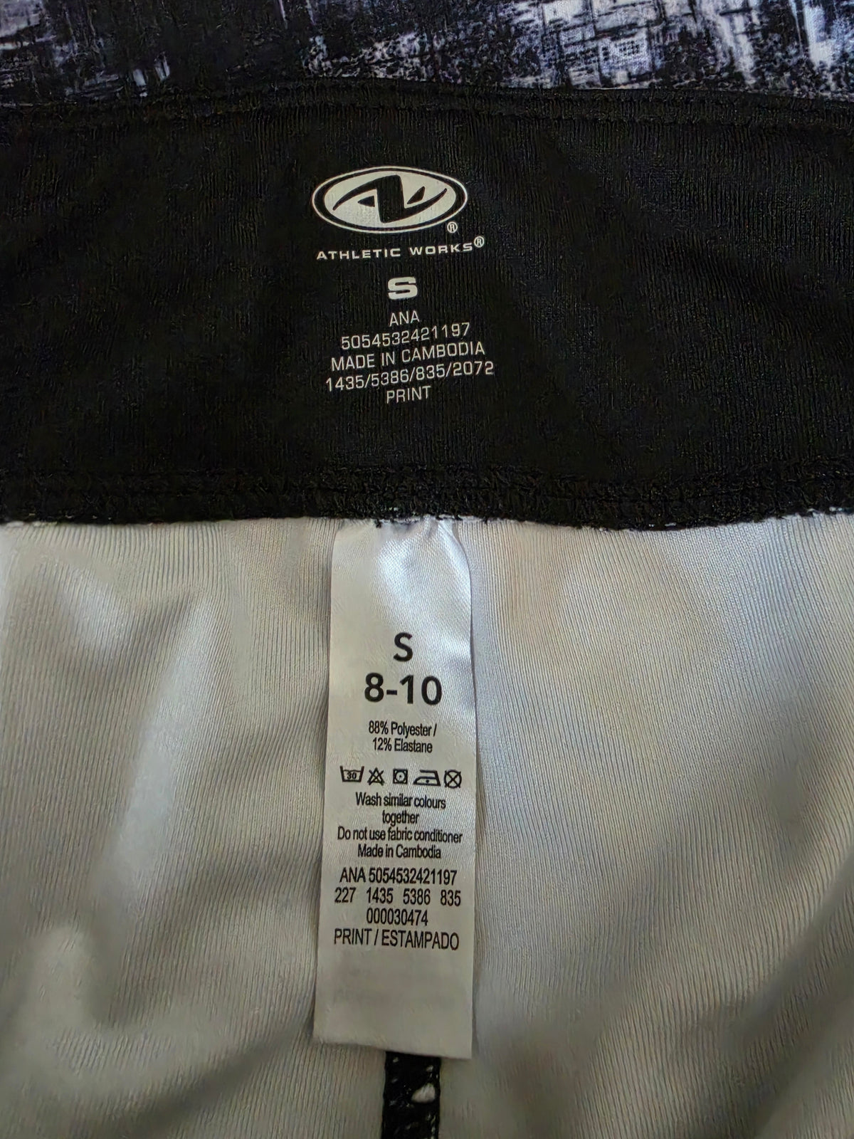 Close-up showing the Athletic Works logo, size S 8-10 and 88% Polyester, 12% Elastane.