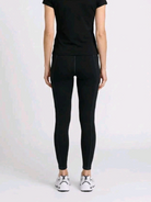 Close up of a man wearing a pair of Athletic Works Black Activewear Leggings back view 
