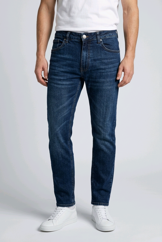 Man wearing a pair of blue jeans with a white t shirt