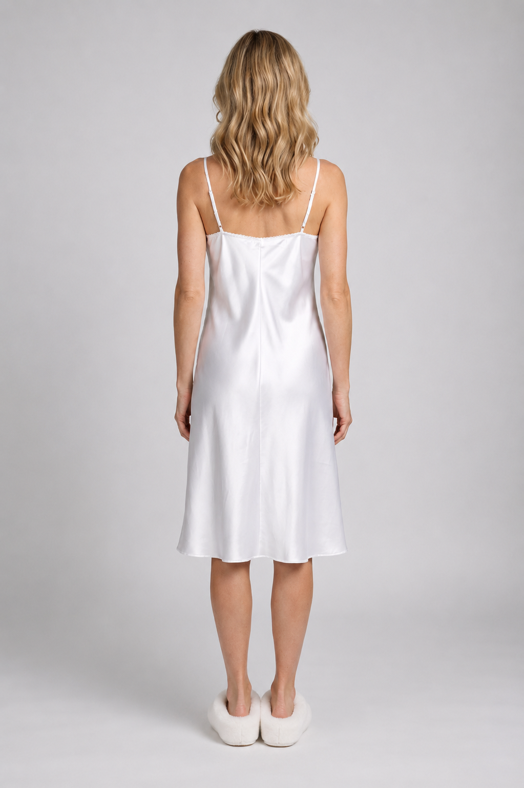 Woman wearing a white slip on nightdress