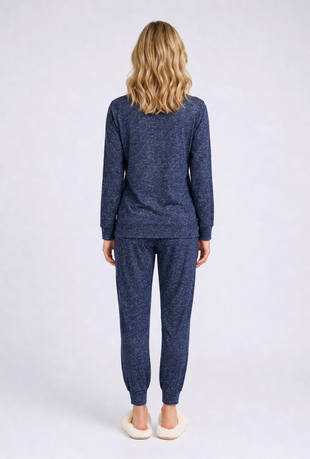 Woman wearing a blue pajama set 