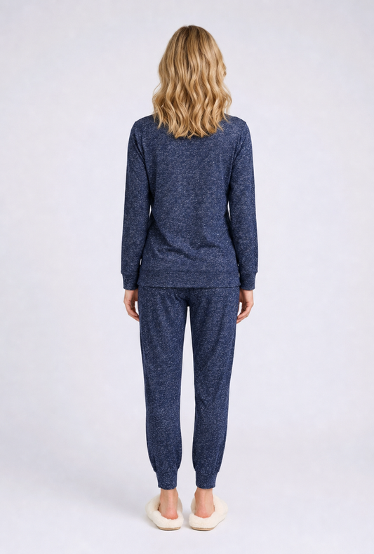 Woman wearing a blue pajama set 