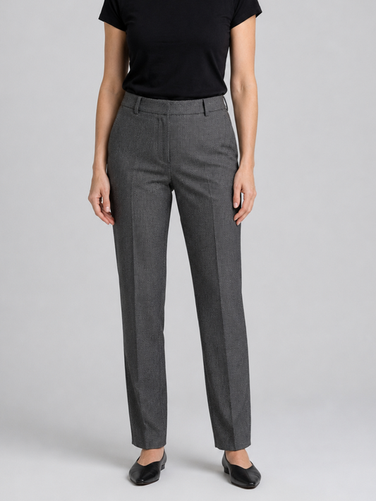 Woman wearing grey trousers and a black top 