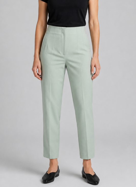 Woman wearing light green trousers