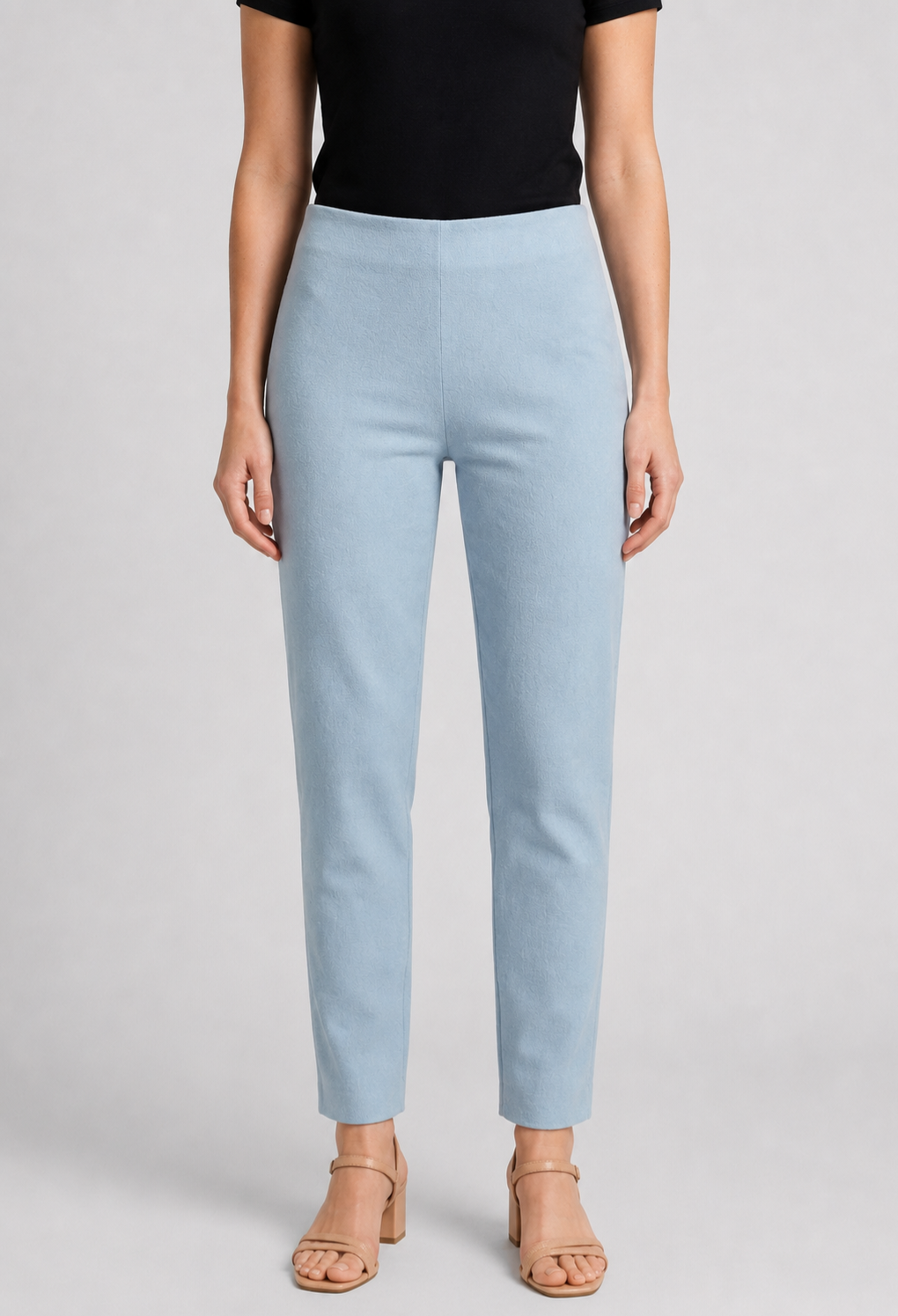 Woman wearing light blue trousers 