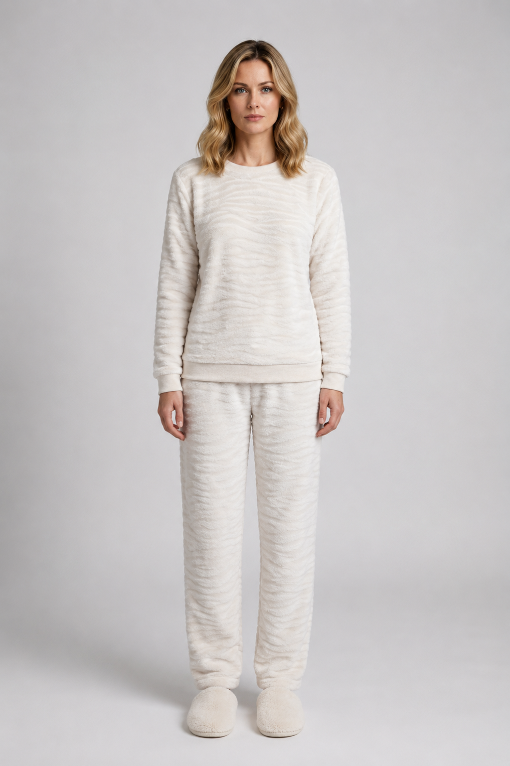 Woman wearing a cream zebra print pajama set