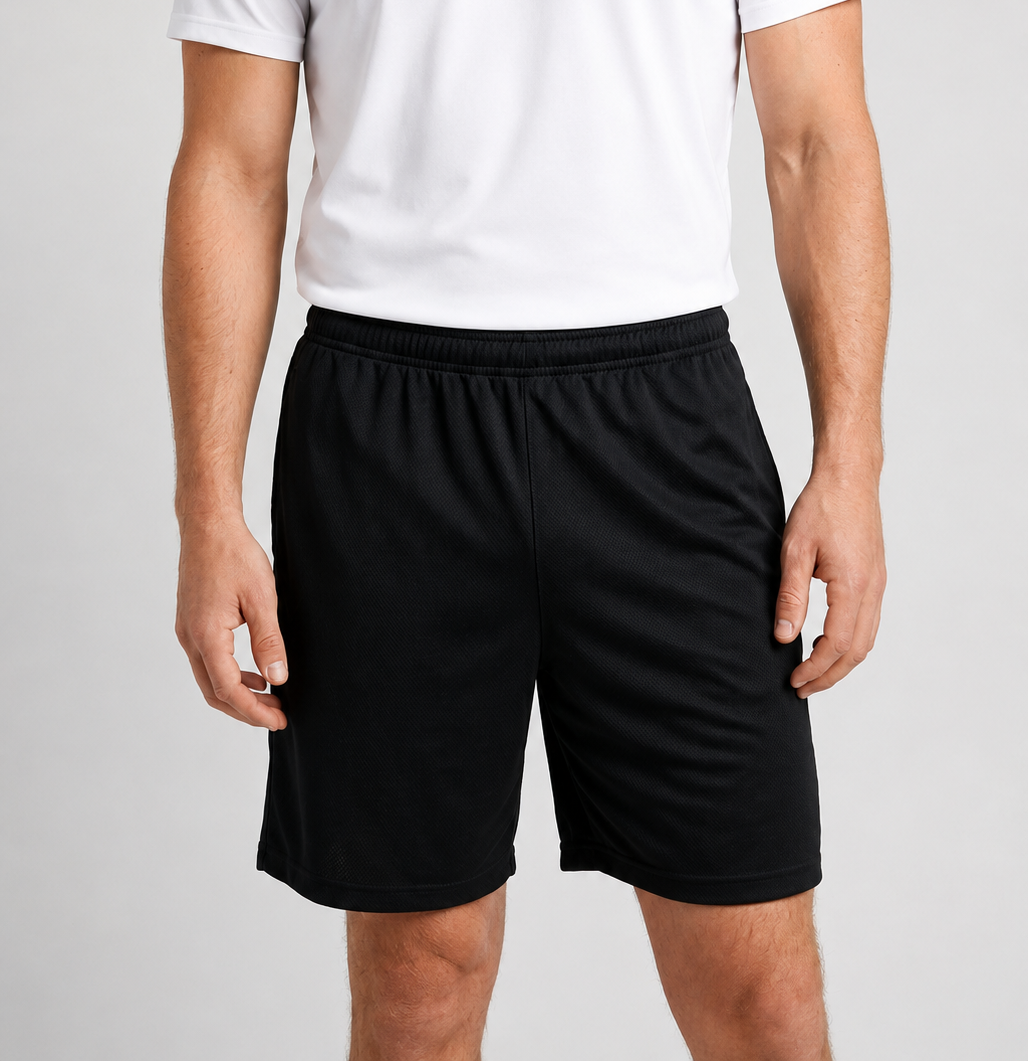 Man wearing black shorts with a white t shirt
