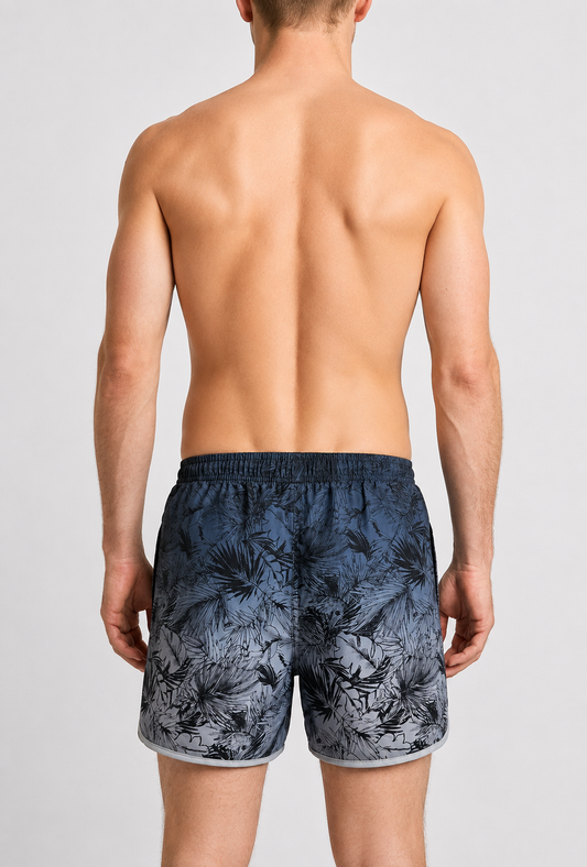 Person wearing navy floral swim shorts 