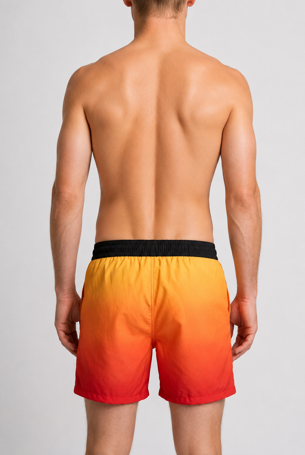 Man wearing orange to red gradient swim shorts 