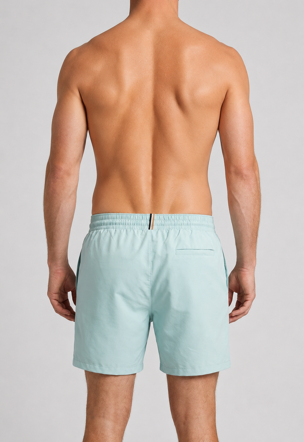 Man wearing mint green swim shorts
