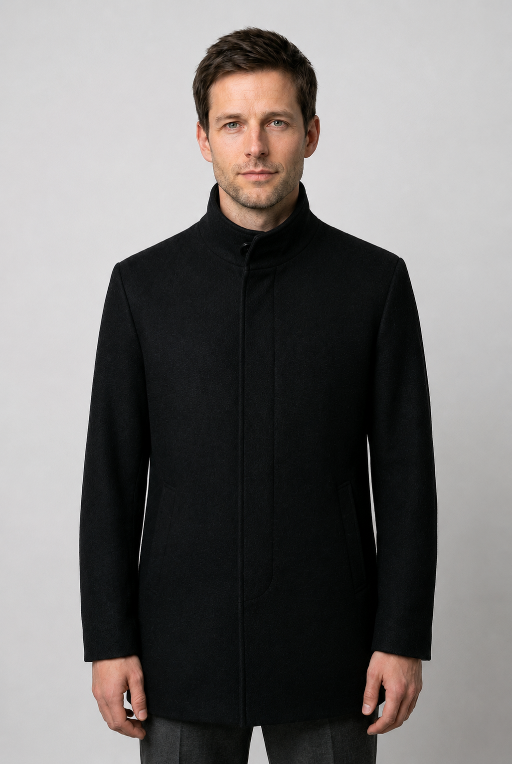 Man wearing a black coat 