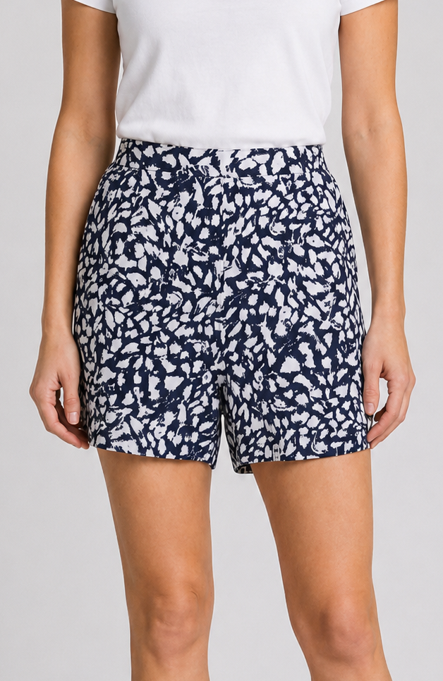 Person wearing navy shorts with white 