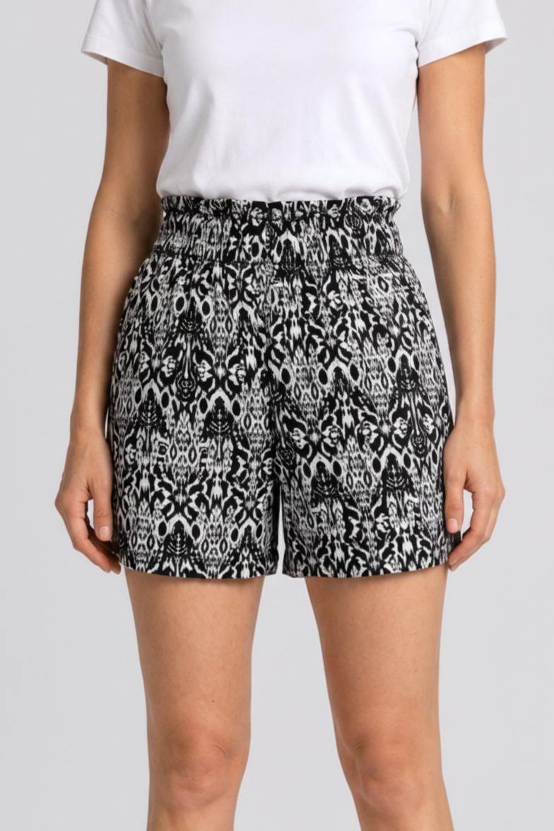 woman wearing black and white patterned shorts 
