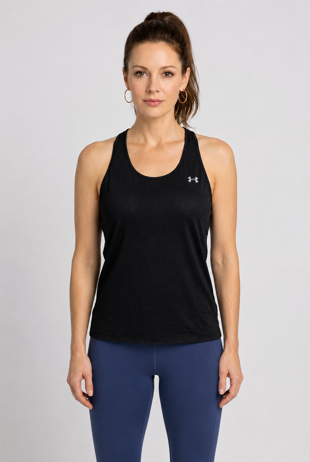 Women wearing Under Armour black vest top