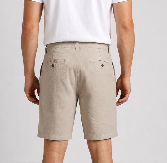 Man wearing beige shorts and a white t shirt