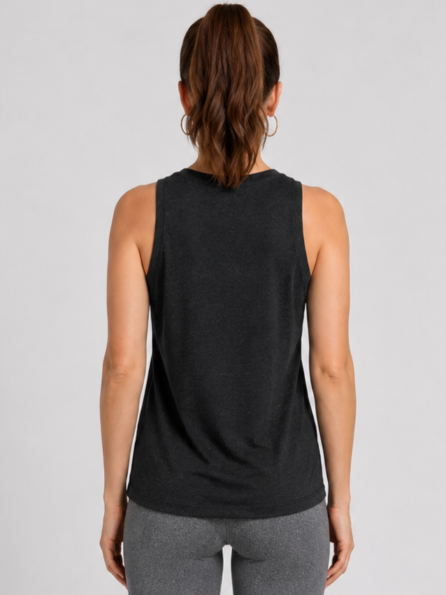 Woman wearing a black sleeveless under armour tank top back view