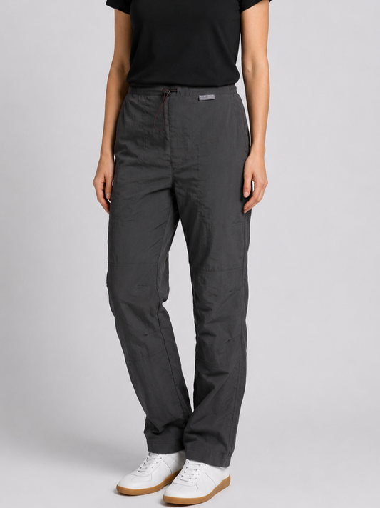 Woman wearing grey Reebok track pants