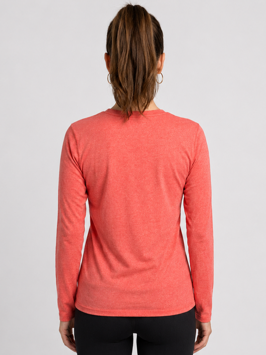 Person wearing a orange long-sleeve top