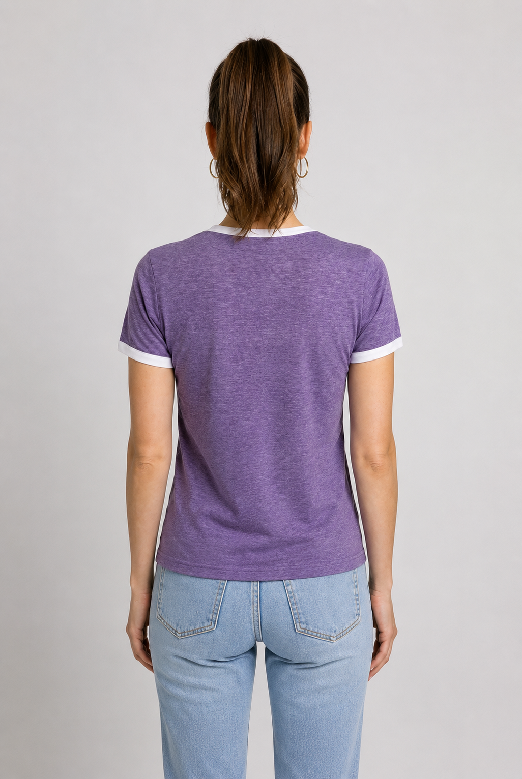 Woman wearing a purple t shirt back view