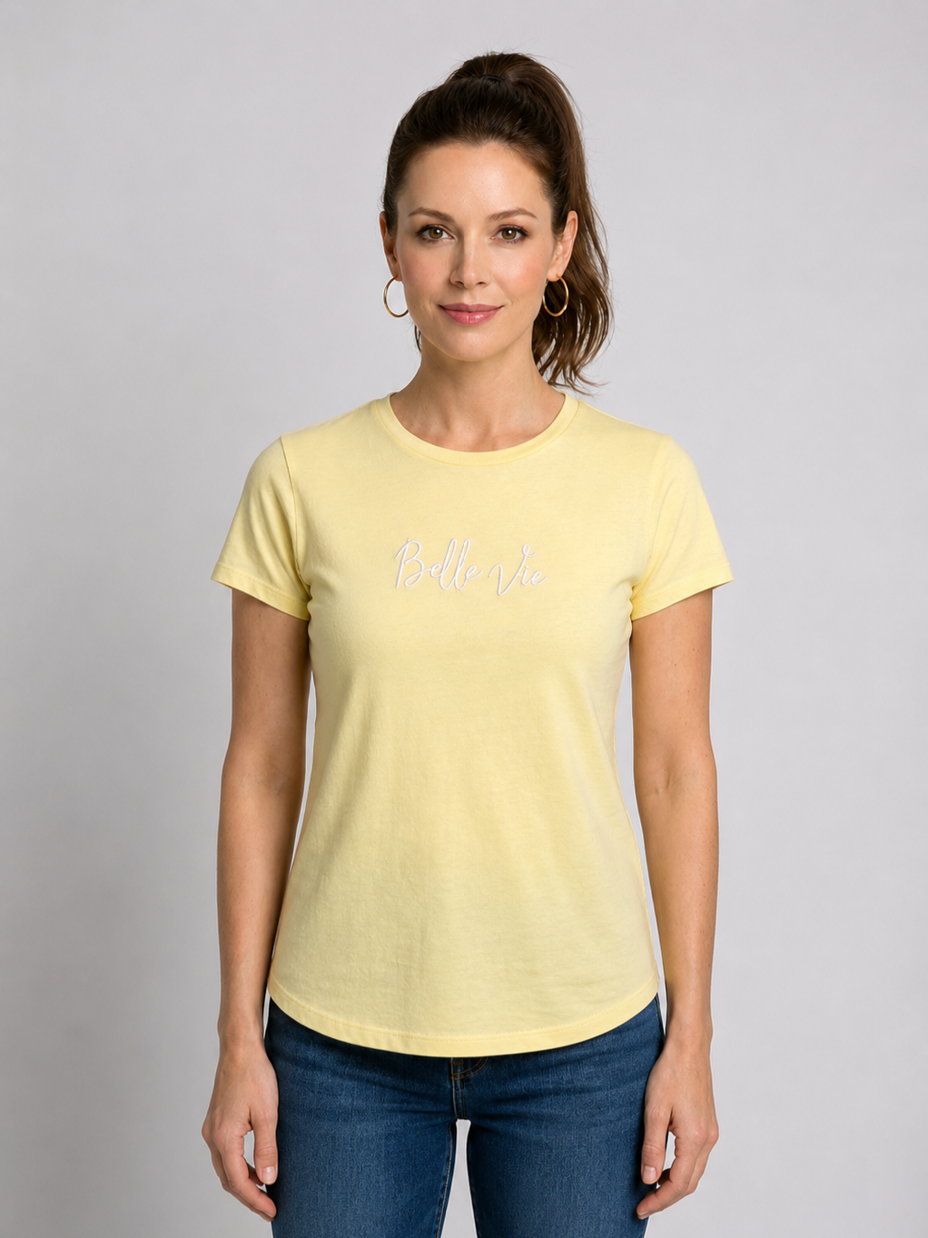 Woman wearing a yellow t-shirt with " Belle Vie" writing