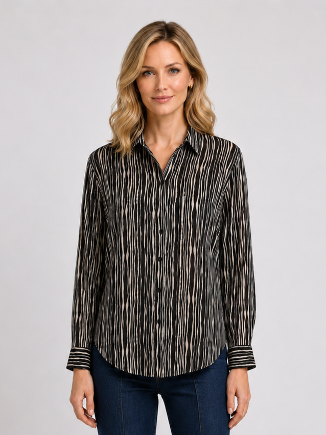 Woman wearing a black and white patterned shirt 
