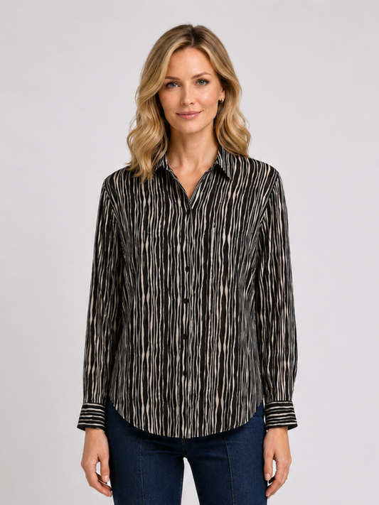 Woman wearing a black and white patterned shirt 