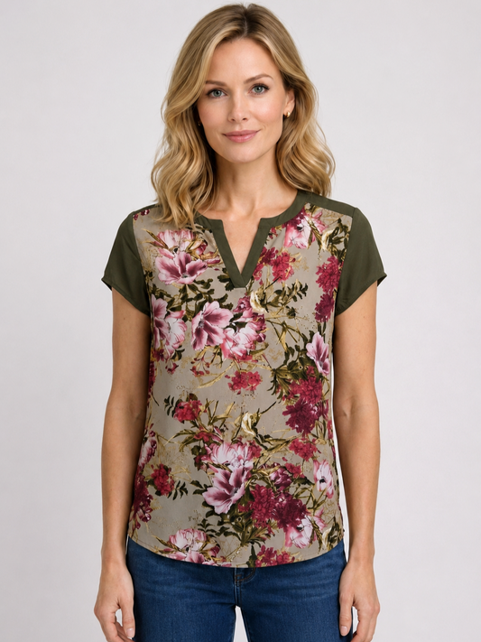 Woman wearing a floral blouse with blue jeans