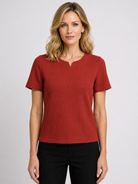 Woman wearing a red textured top 