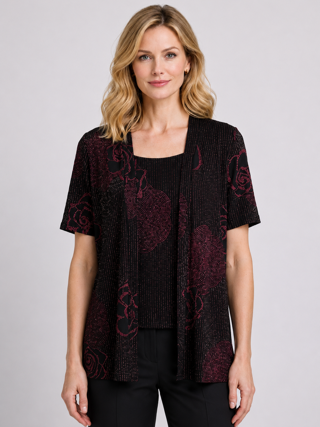 Woman wearing a black and red patterned top 