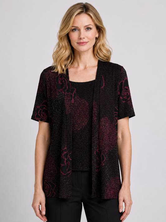 Woman wearing a black and red patterned top 