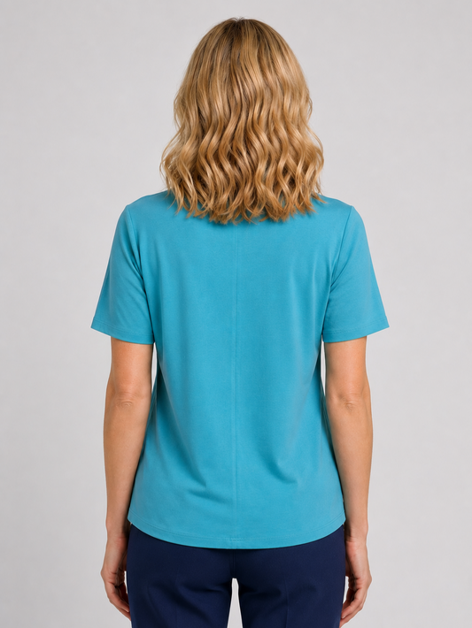 Woman wearing a turquoise  top back view