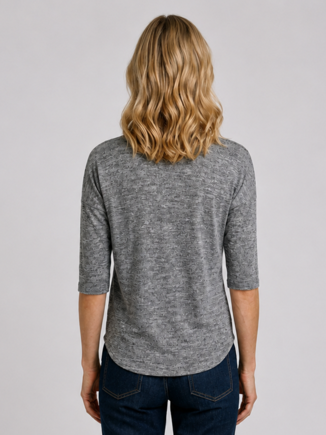 Woman wearing a grey top