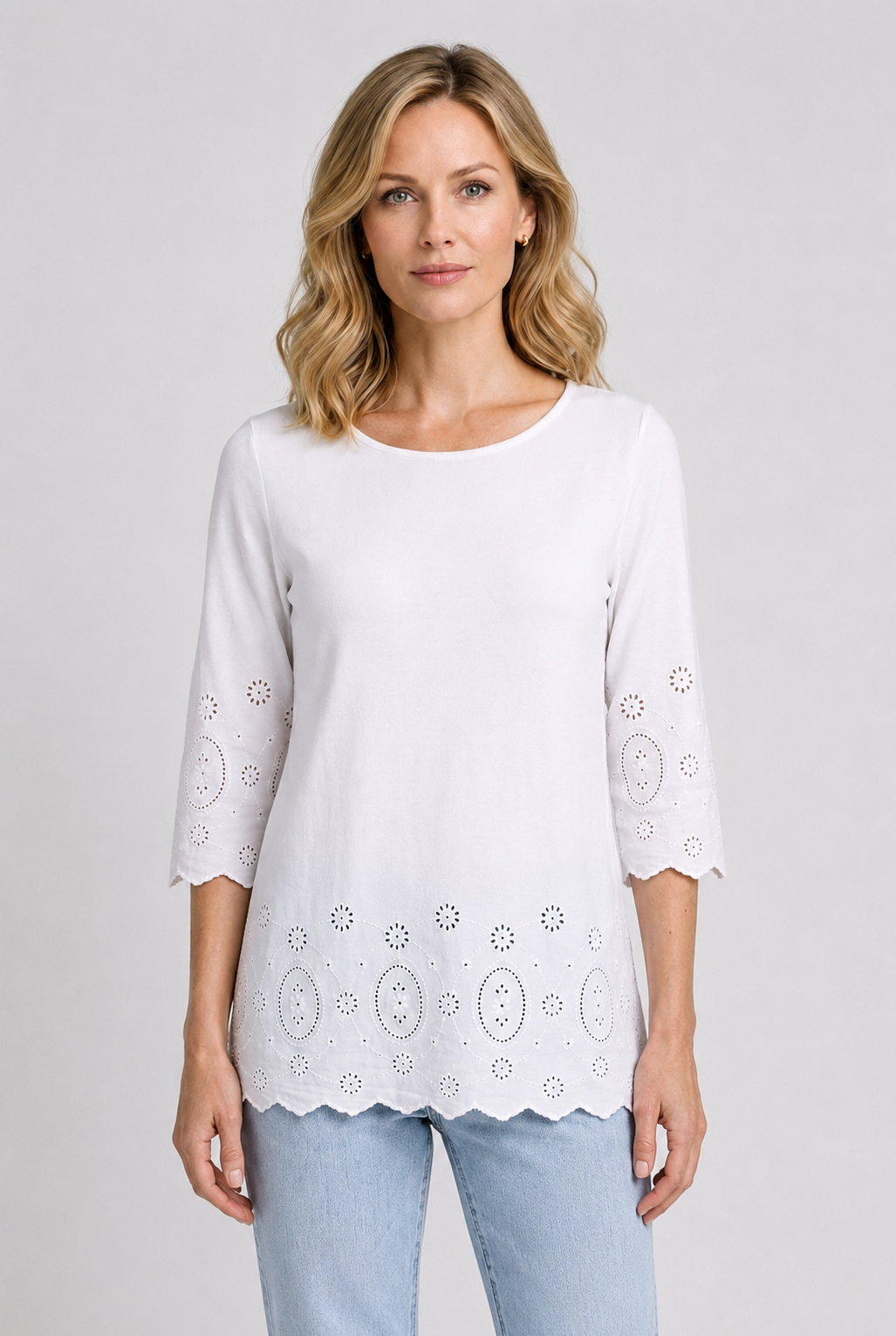 Woman wearing a white detailed top