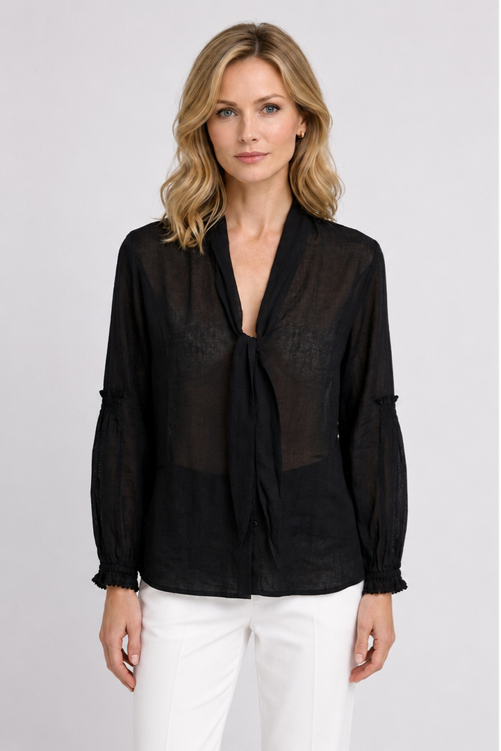 Woman wearing a black tunic top