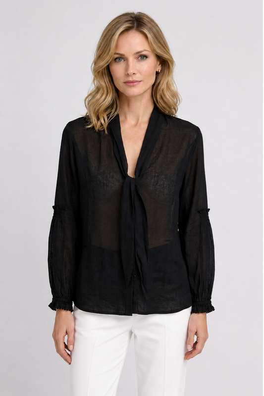 Woman wearing a black tunic top