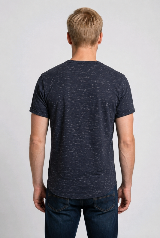 Man wearing a dark blue t-shirt and jeans 
